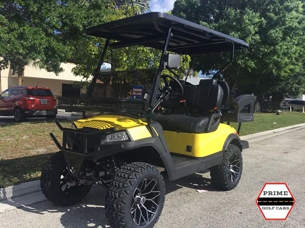 Yellow Aluma 4 Passenger Lifted Golf Cart affordable golf cart rental, golf cart rent marathon
